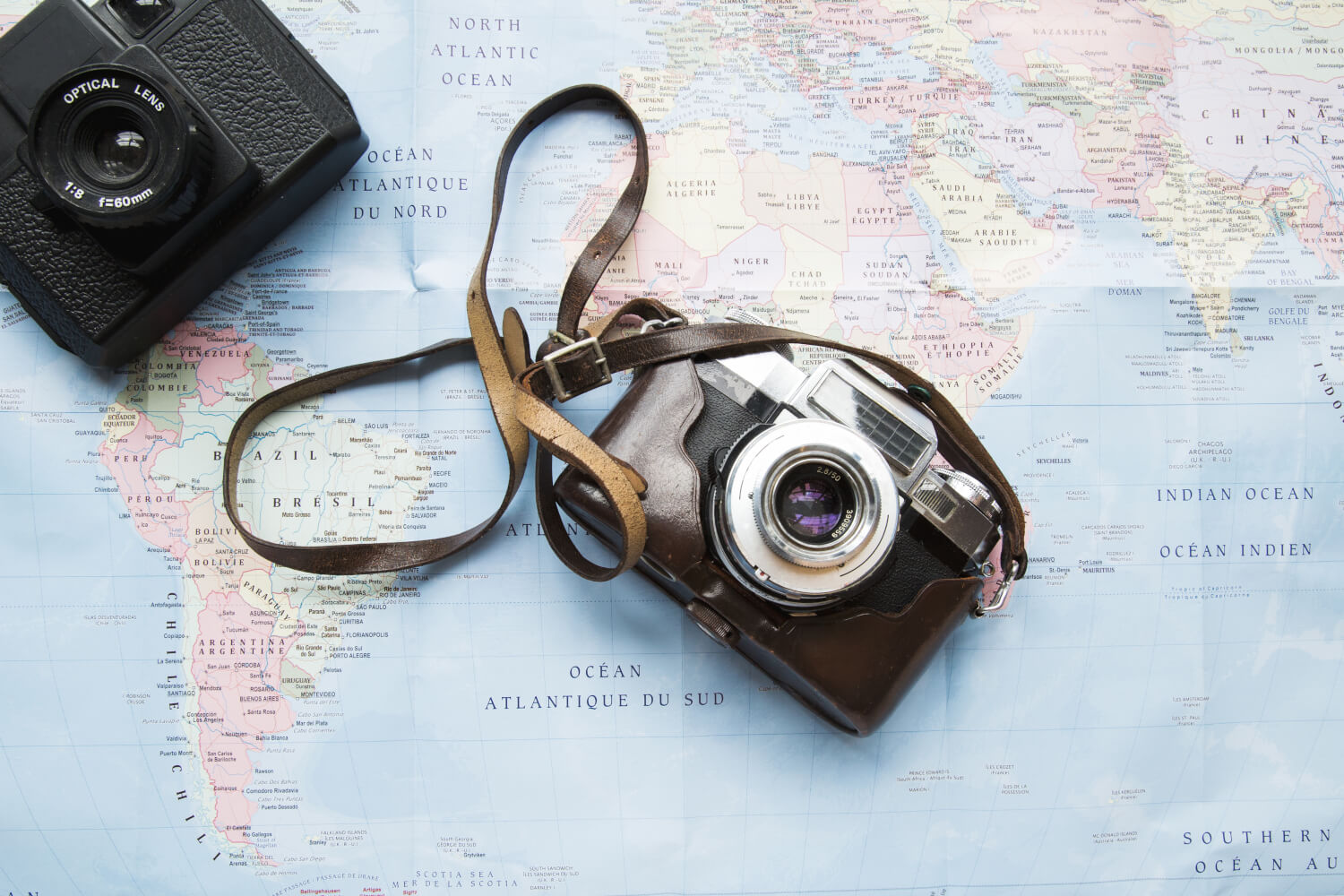 Vintage camera on top of a map