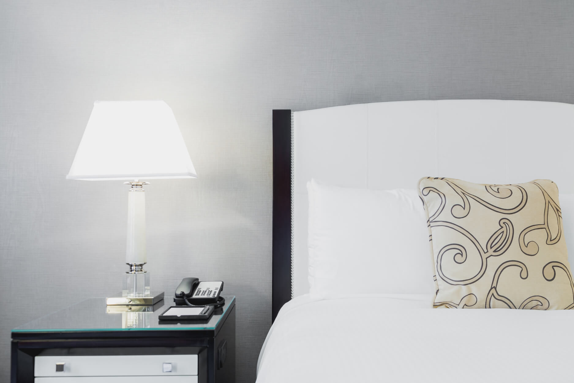 Neat hotel bed and nightstand